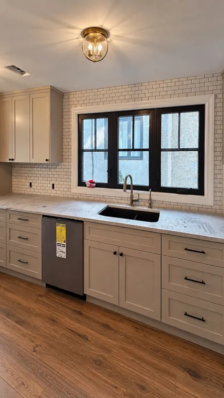 Kitchen with a white tile backsplash