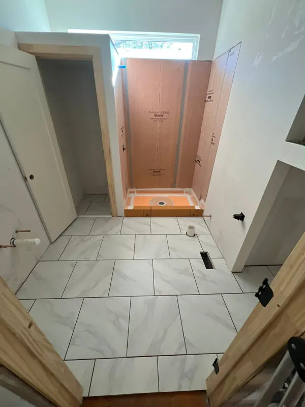 Bathroom tile installation in progress