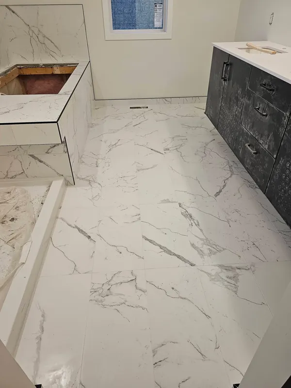 Large-format marble-look bathroom floor tile