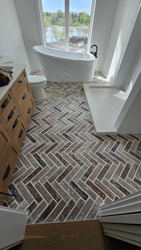 Herringbone tile floor in a bathroom